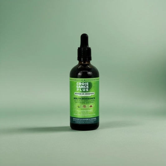 A bottle of Croissance Plus Multricroissance Sérum Capillaire 100ml by JS Organics. with a green label, dropper cap, on a green background.